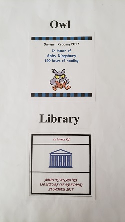 Photo of a bookplate with a cartoon owl and a bookplate with a drawing of a library