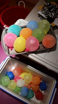 Photo of frozen water balloons on a metal tray
