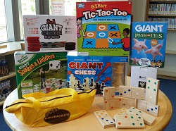 Photo of lawn games including snakes and ladders tic-tac-toe and bananagrams