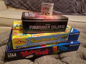 Photo of a stack of four board games