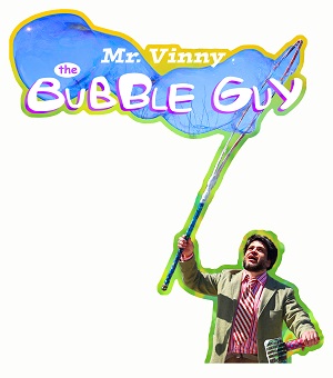 Photo of a man with a large bubble wand making bubbles