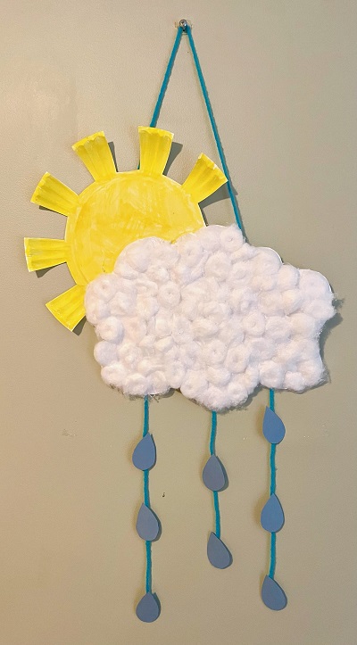 Rain cloud Photo of a yellow sun made of a paper plate and a white cloud made of cottonballs