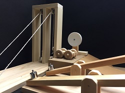 Photo of a setup of small wooden ramps and pulleys
