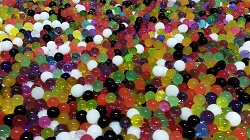 Photo of a tub of multicolored water beads