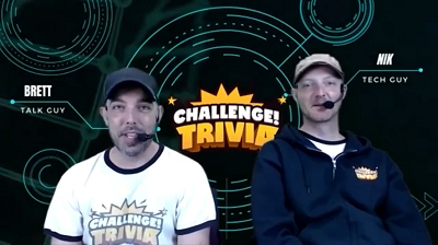 The Trivia Brothers Photo of two men with headsets in front of a sign that says Challenge Trivia