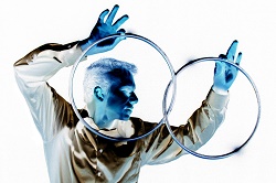 Abstract photo of a man holding two rings