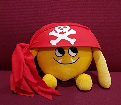 Nibbles in a Pirate Hat Photo of a yellow stuffed animal monster in a pirate hat