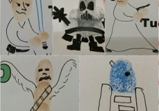 Photo of drawings of star wars characters made using fingerprints