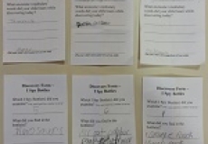 Photo of six pieces of paper forms filled out in pencil