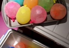 Photo of frozen water balloons on a metal tray