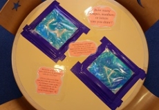 Photo of a child's play table with ziploc bags filled with gel taped to it