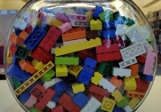 Photo of a glass fishbowl filled with lego bricks