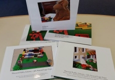 Photo of five photo albums of lego expos from past years