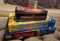 Photo of a stack of four board games