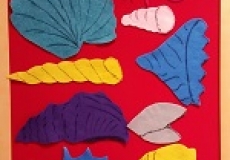 Photo of felt cut into the shapes of seashells