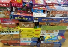 New Board Games getting ready for circulation Photo of two stacks of board games