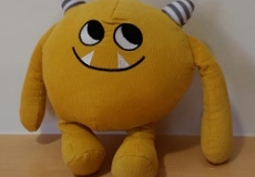 Photo of a yellow stuffed animal monster