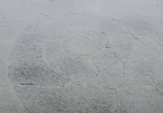 Photo of a stone patio with a light dusting of snow on it