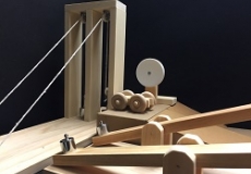 Photo of a setup of small wooden ramps and pulleys