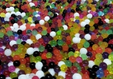 Photo of a tub of multicolored water beads