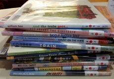 Photo of a stack of library picturebooks about trains